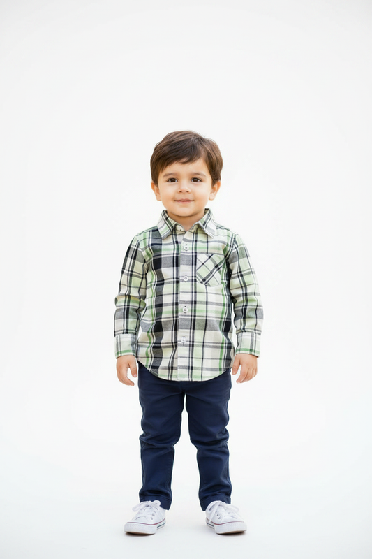 Toddler in plaid shirt with white studio background
